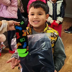 boy-receiving-new-winter-clothing