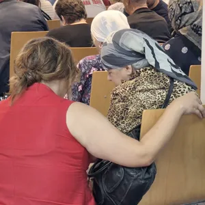 Praying with people in Kosovo